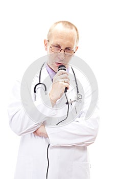 Shy physician speaking in his microphone