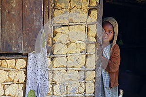 Shy and poor african girl with headkerchief photo