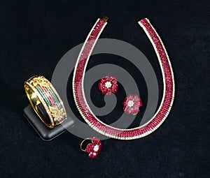 the Siam ruby bracelet, necklace, ring and earring photo