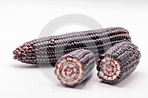 Siam ruby queen corn on isolate white background.It can eat as a fresh,steam,grill,and microwave.Sweet red corn of Thailand.