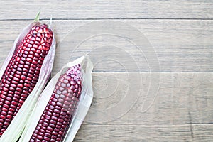 Siam Ruby Queen sweet corn on wooden background