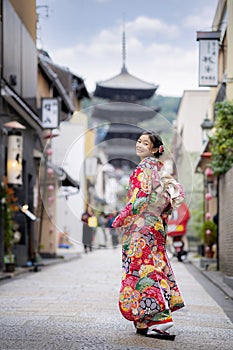 Sian woman wearing japanese traditional kimono at Yasaka Pagoda
