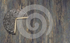 Siant-Nectaire french cheese on wooden background