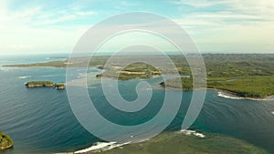 Siargao island and ocean, aerial view.