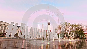 Siauliai city square with fountain during beautiful sunset background. Travel destination