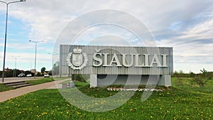 Siauliai sign monument by highway to city