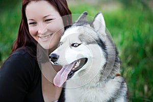 Siberian Husky dog outdoors and a girl