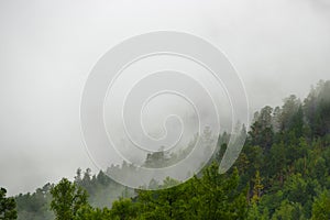 Siberian mountains in the fog