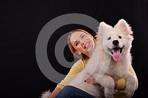 Siberian samoyed and young girl