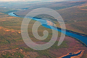 Siberian taiga and the river Tunguska fall from a helicopter photo