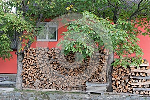 SIBIEL, TRANSYLVANIA/ROMANIA - SEPTEMBER 16 : Logs stored outside a house in Sibiel Transylvania Romania on September 16, 2018