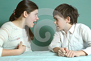 Sibilngs boy and girl arguing