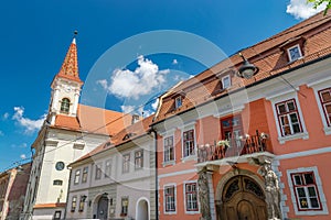 Sibiu, Romania - Beautiful street with Reformed Church and House with Caryatides on a sunny summer day in Sibiu, Romania