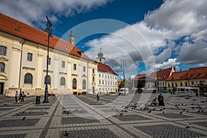 Sibiu, Romania - September 16 2022: Large Square (Piata Mare) with the City Hall and Brukenthal palace in