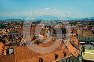 SIBIU, ROMANIA: Top view of the old town and the roofs of traditional houses