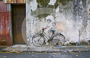 Sibling Cyclist Street Art Mural in Georgetown, Penang, Malaysia