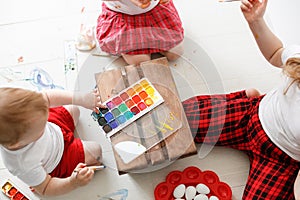 Sibling kids paint eggs , concept Easter