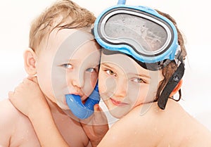 Sibling love - in water with diving equipment