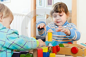 Sibling playing in blocks