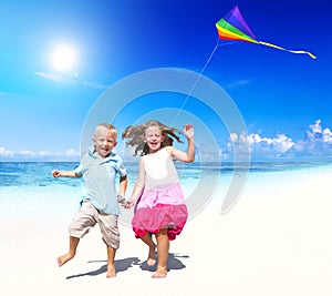 Sibling Playing Together Beach Kite Concept