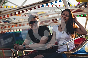 Siblings at an amusement park