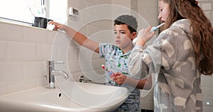 Siblings Brushing Their Teeth