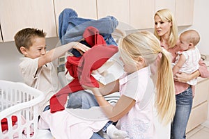 Siblings Fighting While Doing Laundry