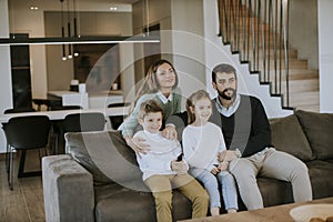 Siblings fighting over TV remote control at home
