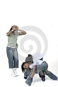 Siblings fighting while stressed mom watches