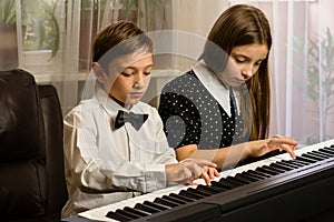 Siblings' Home Piano Practice