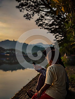 Siblings by the lake