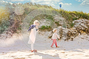 Siblings Near Sand Dune