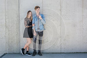 Siblings over urban background with copyspace