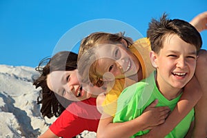 Siblings playing on beach