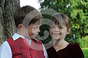 Siblings playing prince and princess photo