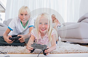 Siblings playing video games