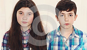 Siblings preteen boy and teenager girl