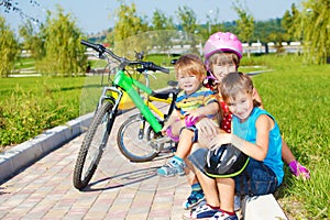 Siblings sitting on grass