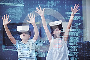 Siblings using virtual reality 3d headset in living room