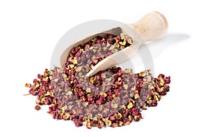 Sichuan chinese pepper with spice shovel on white