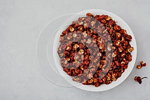 Sichuan pepper. Chinese pepper Zanthoxylum schinifolium in bowl, top view