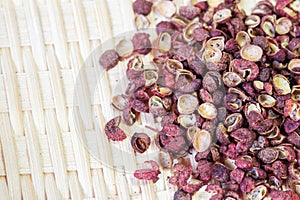 Sichuan red peppercorn close-up in bamboo basket