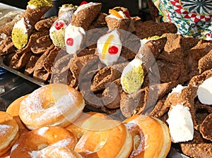 Sicilian cannoli the typical dessert of the Sicily region in southern Italy and the sugary donuts