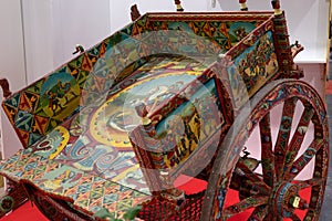 Sicilian cart horse-drawn Vehicle used to Transport Goods, Decorated with Simple Paintings depicting Historical Facts, Adventures