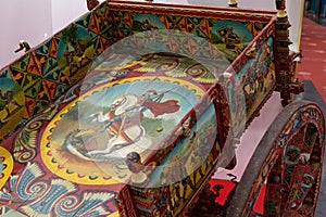 Sicilian cart horse-drawn Vehicle used to Transport Goods, Decorated with Simple Paintings depicting Historical Facts, Adventures