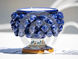 Sicilian ceramic cup of caltagirone town on a table