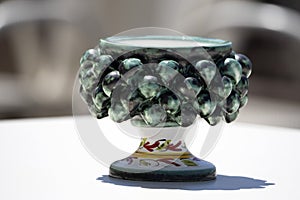 Sicilian ceramic cup of caltagirone town on a table