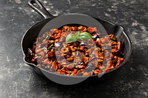 Sicilian Eggplant, Aubergine caponata in iron cast pan