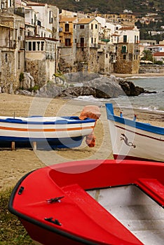 Sicilian fishing boat on the beach in Cefalu, Sicily