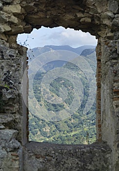 Sicilian island mountain landscape viewed through an ancient castle window